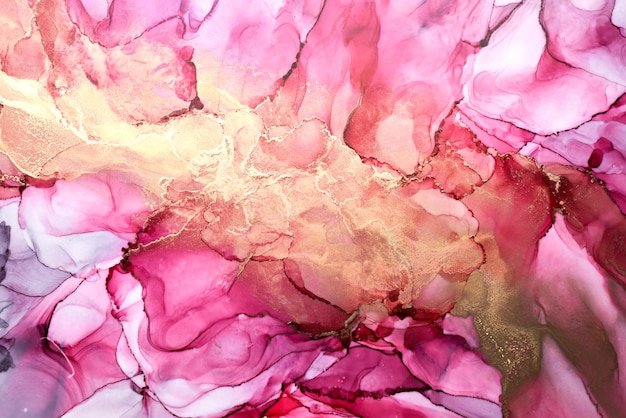 Luxury abstract background in alcohol ink technique pink gold liquid painting scattered acrylic blobs and swirling stains printed materials