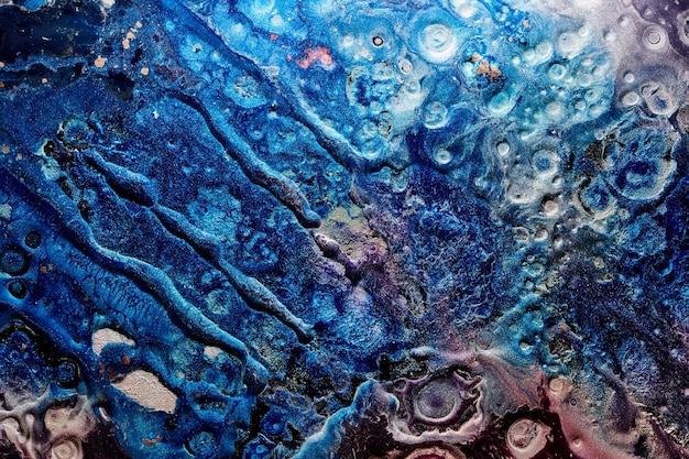 Foto arte liquida di sfondo astratto di lusso inchiostro alcol blu con striature di vernice dorata superficie in marmo texture dell'acqua