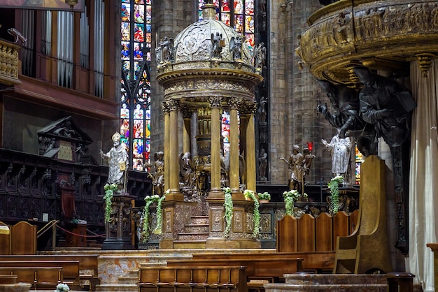 Luxury altar of the old Milan Cathedral Duomo di Milano Famous Gothic Milan temple is a top tourist attraction of city