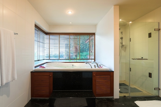 Luxury bathroom features basin, toilet bowl and bathtub