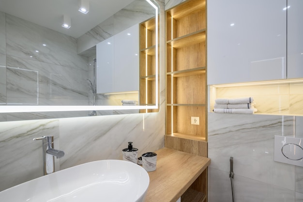 Luxury bathroom interior with marble tiles on the walls