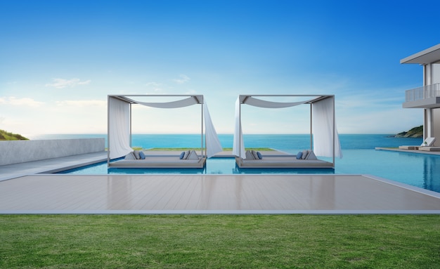 Casa sulla spiaggia di lusso con piscina vista mare e terrazza dal design moderno.