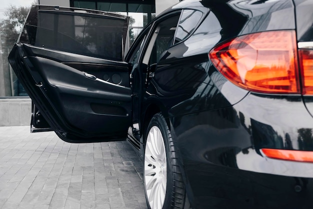 Luxury black executive car, ice tail lights.