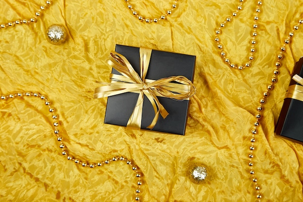 Luxury black gift boxes with gold ribbon
