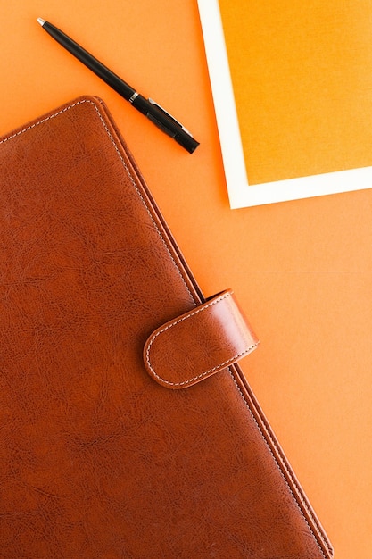 Luxury business brown briefcase on the office table desk flatlay