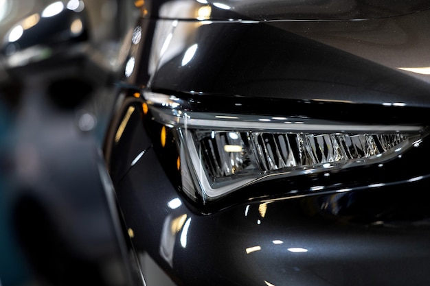 Luxury car tail light on a dark brurred background