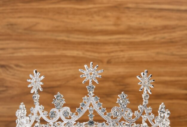 Luxury chic jewelry tiara on a wooden background a fashionable elegant look copy space for text