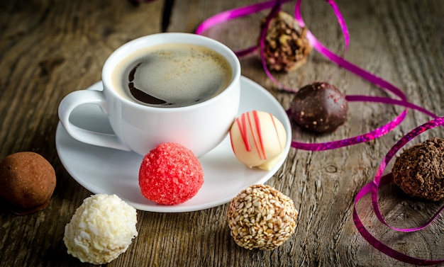 Luxury chocolate candies and cup of coffee