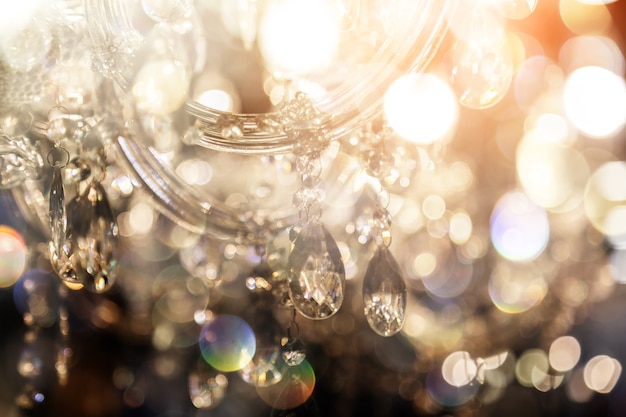 Luxury crystal chandelier close-up. Glamour background with copy space