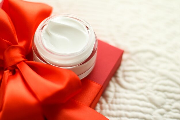 Luxury face cream jar and red gift box