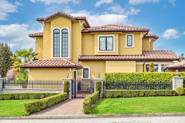 Luxury family house on cloudy sky background