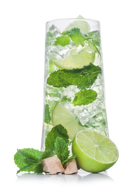 Luxury glass of Mojito summer alcoholic cocktail with ice cubes mint and lime on white background with cane sugar and raw lime