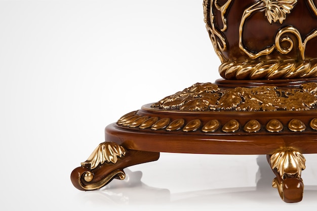 Luxury gold plated leg kitchen table in baroque style. Close-up