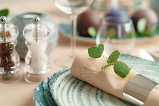 Luxury green table setting decorated with candles