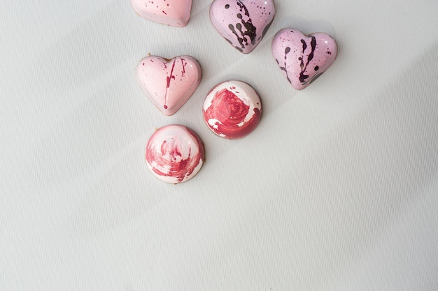 Luxury handmade chocolate heart form candy isolated on bright
background exclusive handcrafted bonbon product advertising concept
for pastry shop