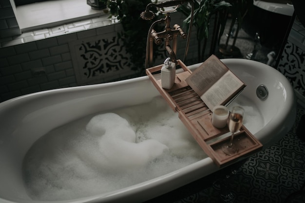 Photo luxury interior of big bathroom at modern african style with oval bathtub in natural lighting