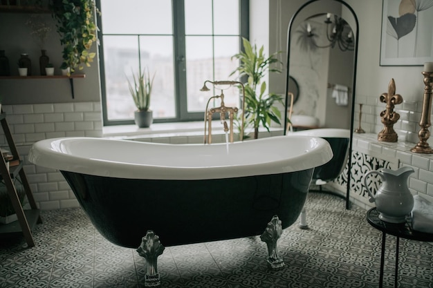 luxury interior of big bathroom at modern african style with oval bathtub in natural lighting