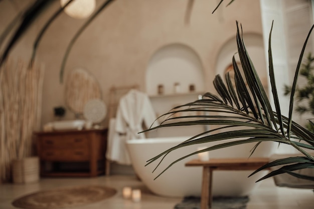 Photo luxury interior of big bathroom at modern african style with oval bathtub in natural lighting