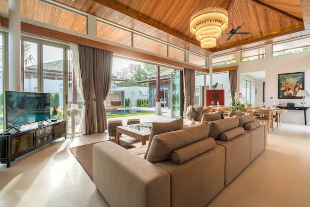 Luxury interior in living room of pool villas. wooden dining table