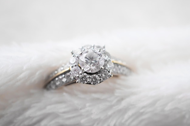 Luxury jewelry diamond ring on white fur texture