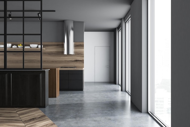 Роскошный интерьер кухни с серыми стенами, бетонным полом, черной столешницей и белой дверью. 3d рендеринг макет