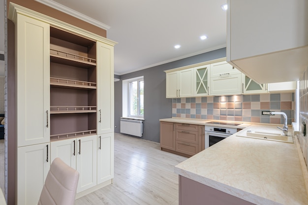 Luxury modern provence styled grey, pink and cream kitchen interior