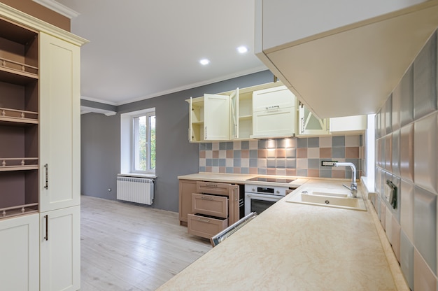 Luxury modern provence styled grey, pink and cream kitchen interior