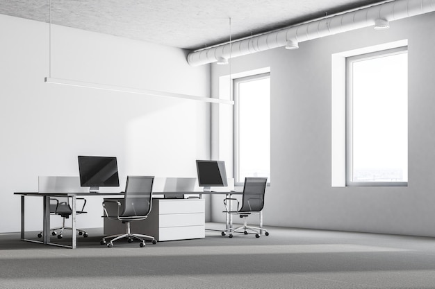 Luxury office interior with white walls, large windows, a concrete floor and rows of computer tables. 3d rendering mock up