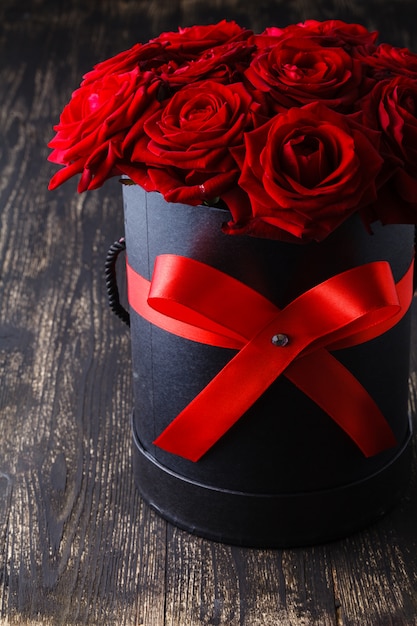 Luxury red roses on a wood