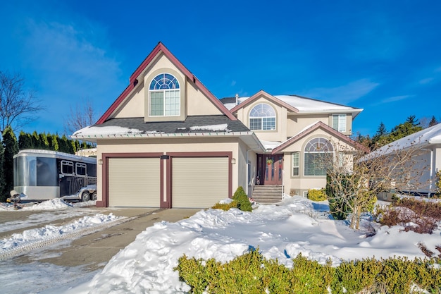 Luxury residential house with double garage on winter season