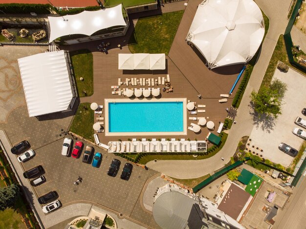 Luxury resort with pool in forest aerial view