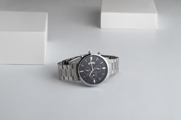 Luxury silver watch on white Table Business man accessories