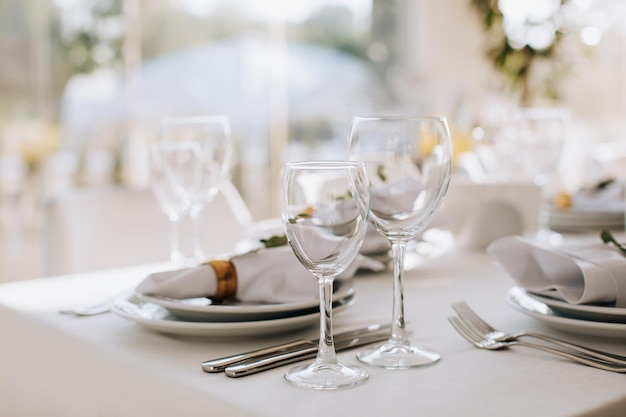 Luxury table setting for dining in pastel colors in restaurant