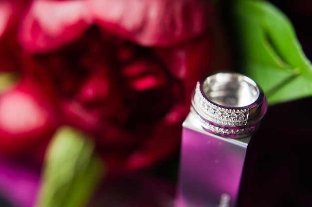 Luxury wedding rings with diamonds on flowers