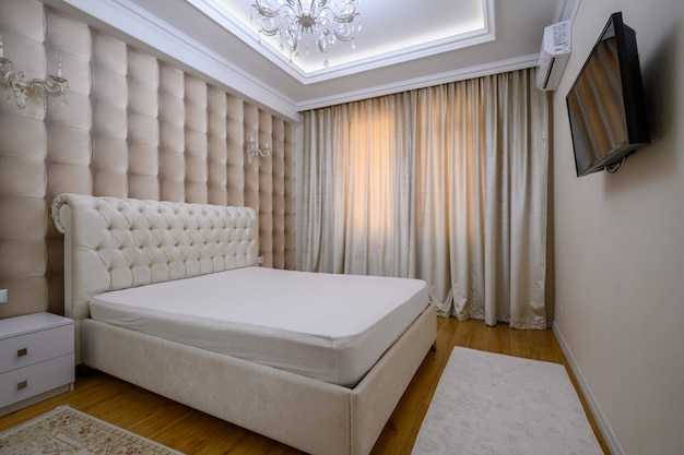 Luxury well designed modern beige master bedroom