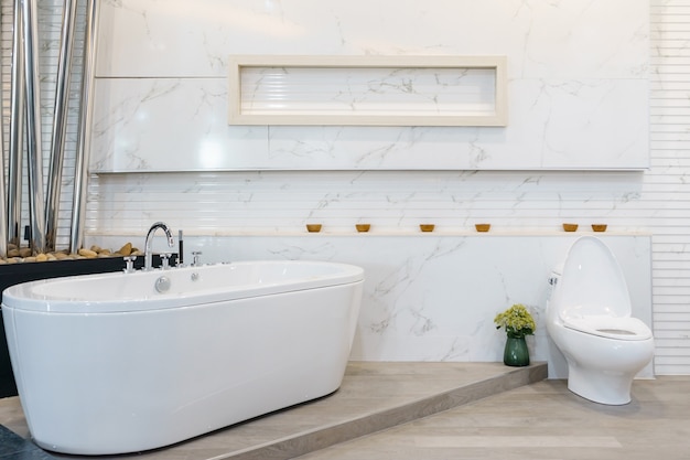 Luxury white bathroom interior with white tiles