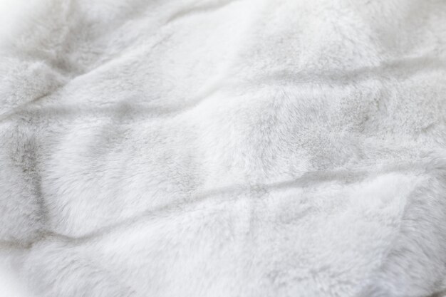 Photo luxury white fur coat texture background artificial fabric detail