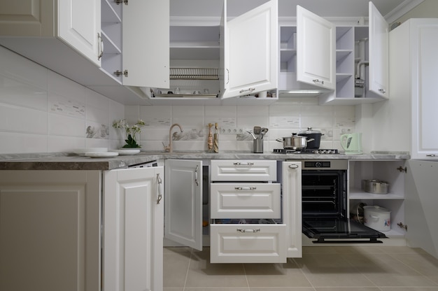 Luxury white modern kitchen furniture with doors open