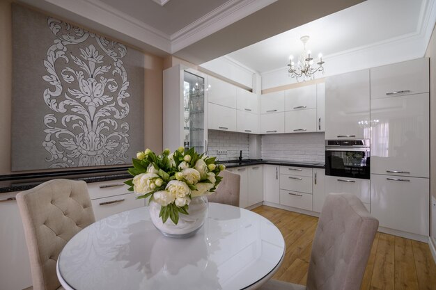 Luxury white modern kitchen with dining table