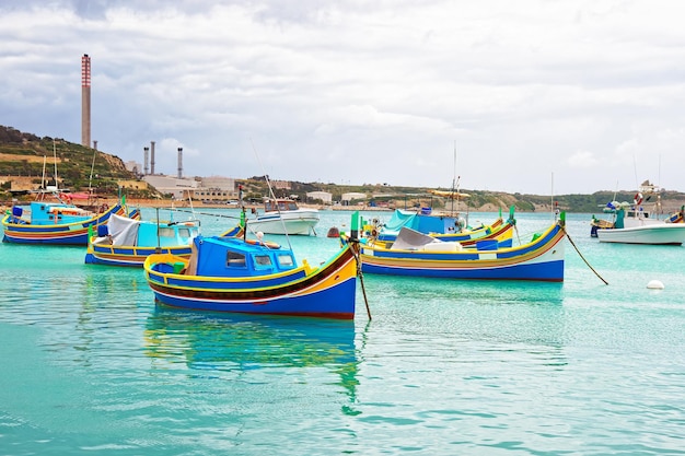 Luzzu colorful boats at Marsaxlokk Harbor of Malta island