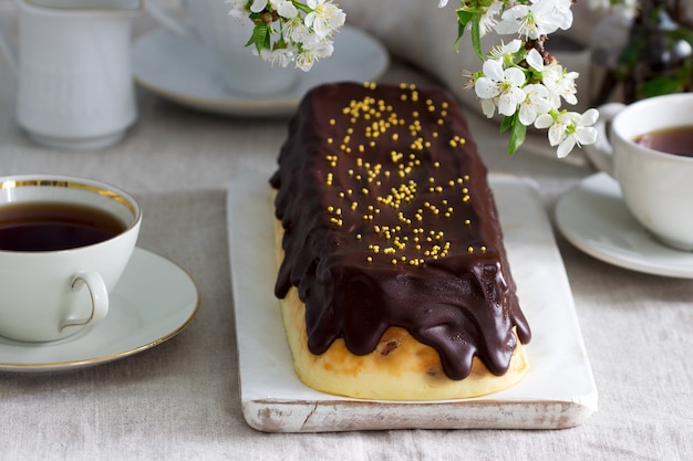 Lviv cheesecake, a traditional Ukrainian dessert with raisins, coated with chocolate icing.