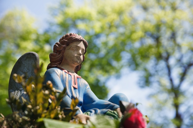 LVIV, UKRAINE - Apr 27, 2016: Old statue on grave in the Lychakivskyj cemetery of Lviv, Ukraine. Officially State History and Culture Museum-Preserve - Lychakiv Cemetery