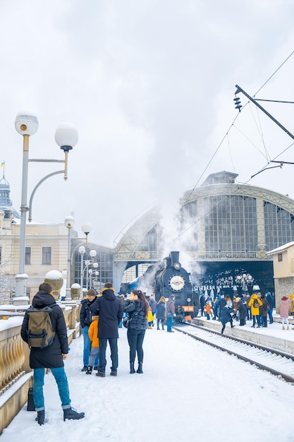 Lviv Ukraine  January 9 2022 people tourists near old stem train attraction