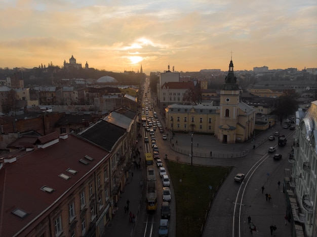 Lviv Ukraine November 11 2018 aerial view of sunset above old european city car traffic