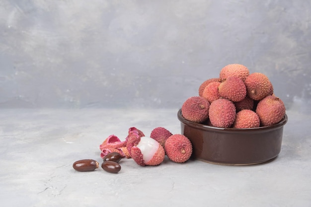 Lychee exotic fruits in bowl Fresh Longan tropical fruit in Thailand