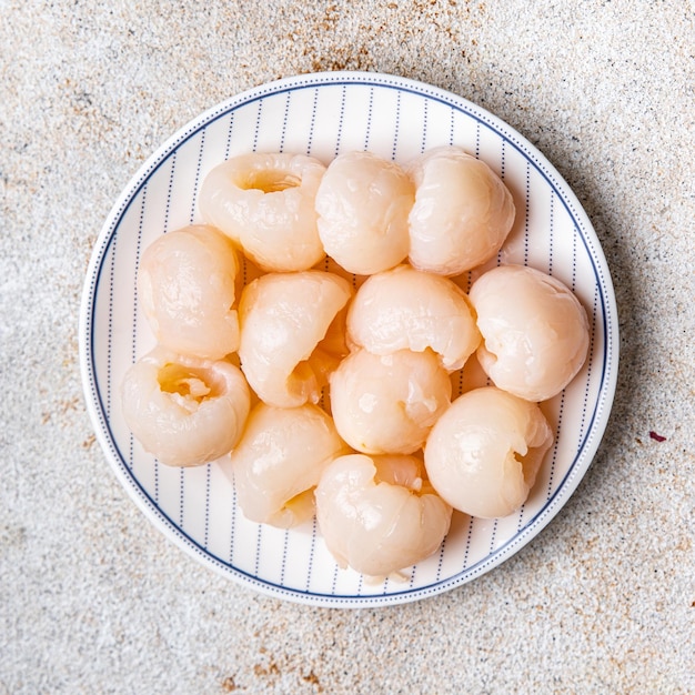 Foto lychee fruit ingeblikte verse snack maaltijd eten snack op tafel kopie ruimte voedsel achtergrond rustiek