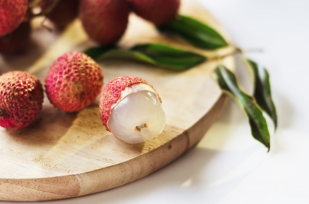 Lychee fruit on a wooden board