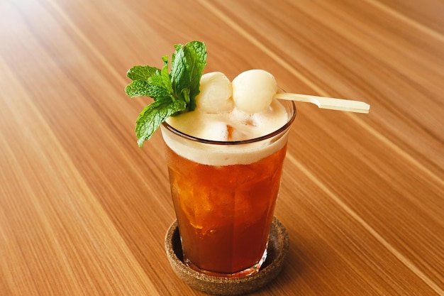 Lychee iced tea with mint leaves