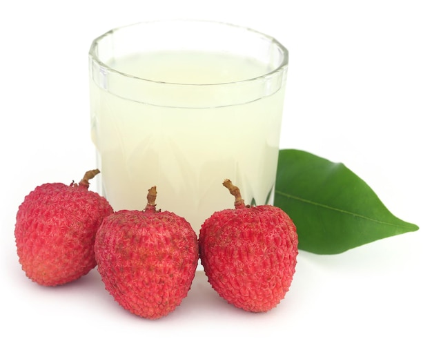 Lychee juice with fruits over white background