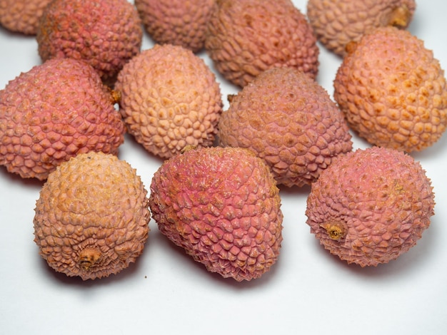 Lychee on the table Chinese plum on a white background Ripe fruit from Asia Delicious product